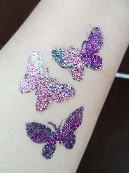 A trio of beautiful butterflies in shades of purple and silver glitter. This design looks lovely placed along the arm.
