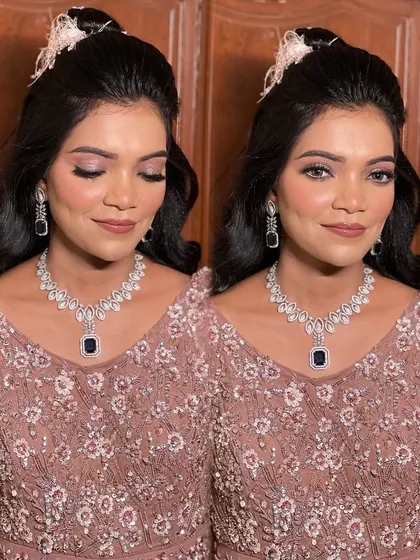 A glamorous sangeet look with soft pink makeup and a stunning diamond and sapphire necklace.