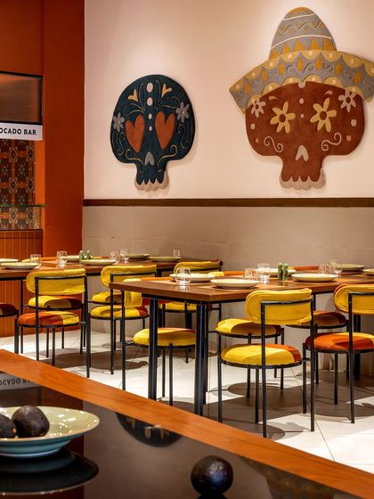 We paid homage to Mexican heritage with bold, artistic statements throughout Tres Amigos. These large, hand-tufted skull rugs, designed in collaboration with Studio Arisaa, reinterpret traditional motifs with vibrant colors, serving as striking focal points against the restaurant's clean walls.