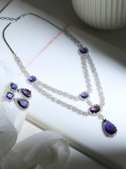 The complete Amethyst Bridal Set laid out. This view shows the harmony between the double-layered necklace and the matching earrings, a symphony of amethysts and diamonds.