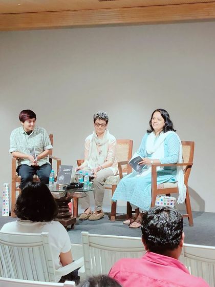 A panel of speakers on stage during a book discussion in our auditorium.
