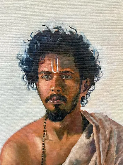 A close-up detail of my oil painting 'Adhyaẏana'. This shot highlights the detailed brushwork on the face, the tilak on the forehead, and the texture of the curly hair, showing the level of realism I strive for.