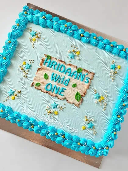 Planning a big celebration? A sheet cake is a great way to ensure every guest gets a slice. This one was designed to match a "Wild One" theme, providing extra servings without compromising on style.
