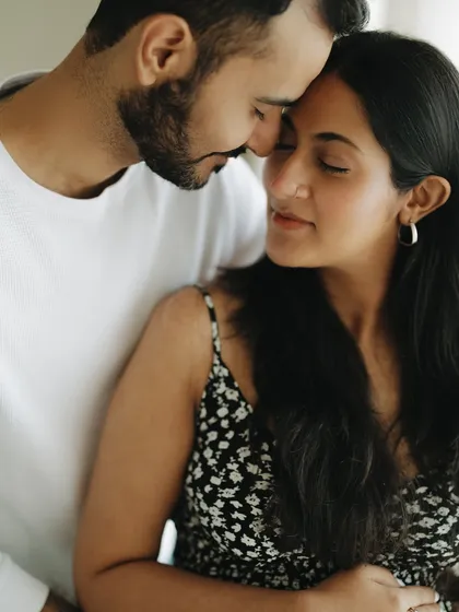These are the quiet moments I cherish the most. The gentle touch, the shared breath, the feeling of being completely connected before your world changes forever. It’s about capturing the love that started it all.