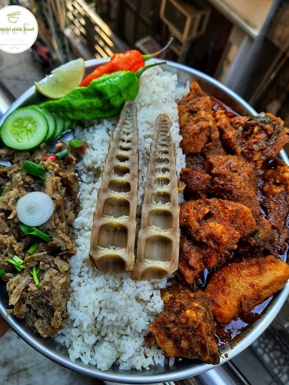 A truly authentic meal featuring boiled bamboo shoots, buff curry, and a fresh bamboo shoot salad (laiwa singju).