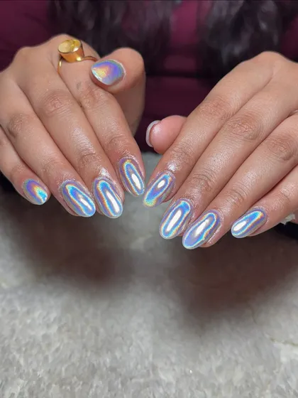 For a futuristic and eye-catching vibe, I used a special holographic chrome powder over these almond-shaped extensions. The way they shift colors in the light is just mesmerizing.