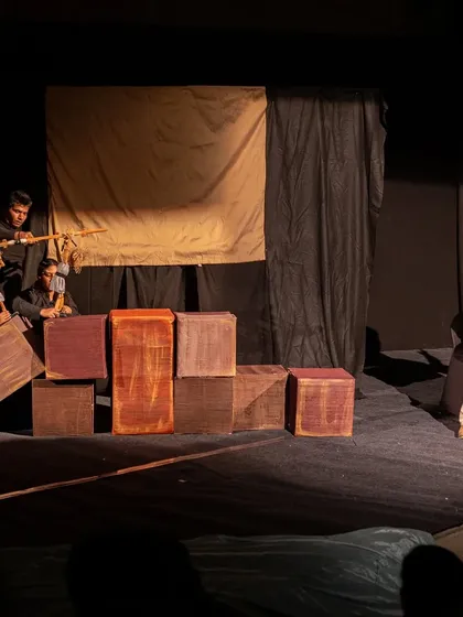 The full stage is used to show the Lilliputians capturing the giant Gulliver. The creative use of simple props and different-sized puppets makes the story come alive.