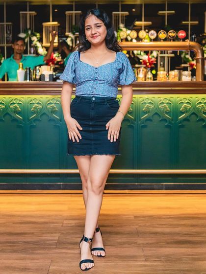 A guest posing at the bar at TYD.