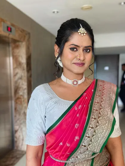 A portrait of the happy bride. Her traditional makeup and jewelry make for a timeless and beautiful bridal look.