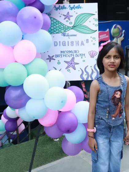 A warm welcome to a Mermaid Birthday Bash. The custom welcome sign and pastel balloon arch create an enchanting entrance for the birthday girl and her guests.