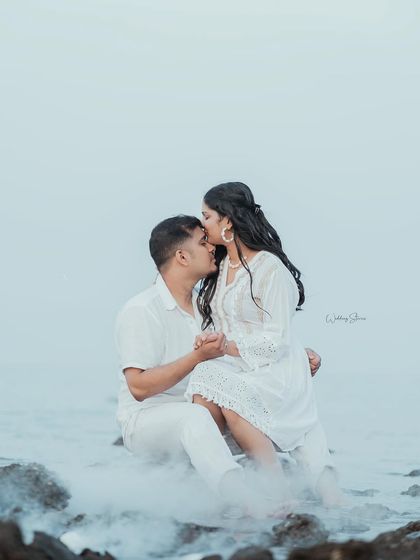 A tender forehead kiss, made even more romantic with the misty smoke effect. This is a perfect example of a soft, intimate portrait from a beach pre-wedding session.