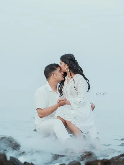 A tender forehead kiss, made even more romantic with the misty smoke effect. This is a perfect example of a soft, intimate portrait from a beach pre-wedding session.