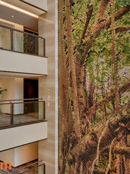 At the Taj Bangalore, a five-level atrium is anchored by a massive tree-inspired sculpture, a nod to Bengaluru’s “Garden City” heritage. This piece, made of countless small reflective tiles, captures and plays with the natural light from the skylight above.