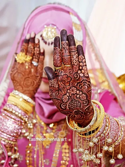 This is the moment it all comes together. Seeing my bride Afra, radiant in her full wedding attire with her dark mehndi stain and jewelry, is the most rewarding part of my work.