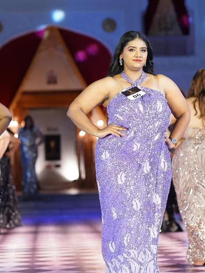 A vibrant lavender sequined plus-size gown. This color is so fresh and modern, and the draped design is incredibly flattering.