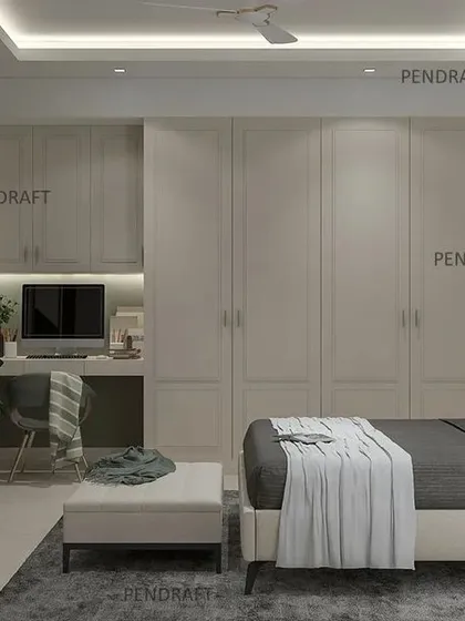 This angle reveals the full wall of seamless wardrobes with a built-in study nook, demonstrating our expertise in creating multi-functional, space-saving modular solutions.
