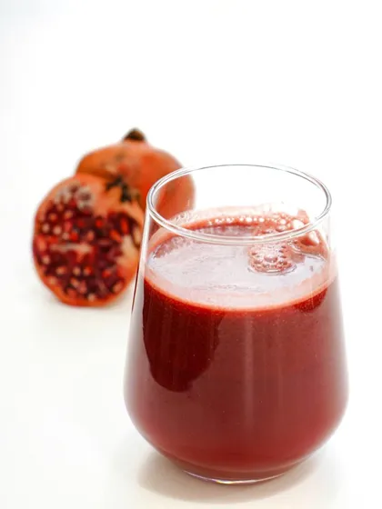 We offer a range of fresh juices to energize your morning, like this vibrant pomegranate juice, pressed to order for maximum freshness and flavor.