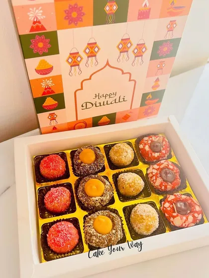 Introducing the 'Nayaab Diwali Box', filled with my fusion laddoos and chocolates. This one includes Lemon Coconut Foxnut Laddoos, Almond Apricot Foxnut Laddoos, and Red Velvet Chocolates.