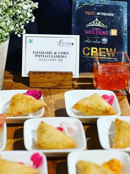 Edamame and Corn Phyllo Samosas, a light and crispy appetizer served with a sweet chili dip, created for the Femina Miss India event.