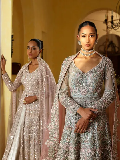 Two models styled in complementary pastel gowns with intricate embroidery and cape details. This demonstrates my approach to creating a harmonious visual story for a brand campaign or a bridal party.