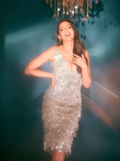 I styled Nora Fatehi in this sparkling retro tassel dress from Falguni Shane Peacock. It's a fun, glamorous party look that's all about movement and shine, perfect for a high-energy event or photoshoot.