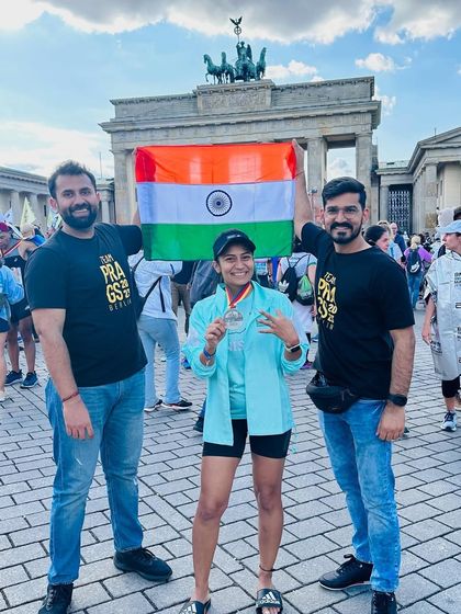 A duplicate of image 127. The support crew that gets you through 42.2kms. With my husband and friend at the Brandenburg Gate after the Berlin Marathon.
