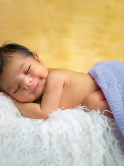 There is nothing more precious than a newborn's smile. We capture these fleeting moments in our cozy studio, ensuring your baby is safe, comfortable, and peacefully asleep for their first infant photoshoot.