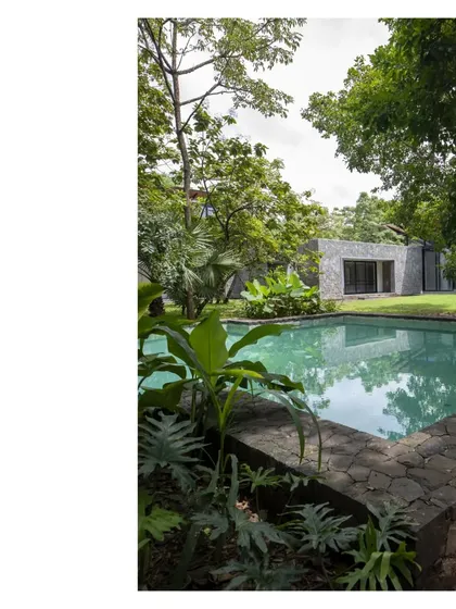 Sense of place is a key ingredient. Nestled within a grove in Alibaug, this villa embraces the trees it occupies, delivering an alfresco living space under the natural canopy where life is lived out of doors.