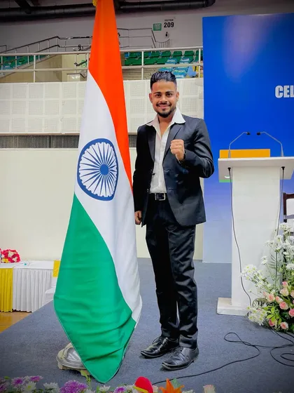 My pride, my identity. Standing with the Indian flag. My goal is to bring glory to my country through my students.