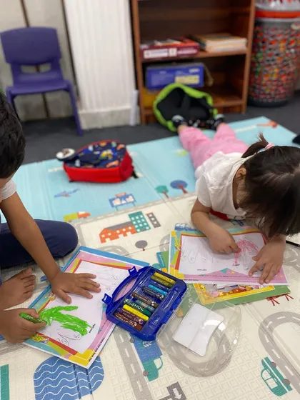 Quiet focus during creative time. Our early childhood music program includes activities like coloring musical worksheets, which helps reinforce concepts and develop fine motor skills.