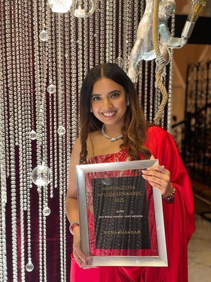 A close-up with my award. This win is not just mine; it belongs to my team, my clients, and every well-wisher who has cheered me on. Here's to many more milestones together.