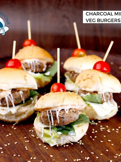 These Charcoal Mini Veg Burgers are a unique and delicious option for your guests. The charcoal-infused patty provides a subtle smoky flavor, complemented by fresh toppings and a soft bun.