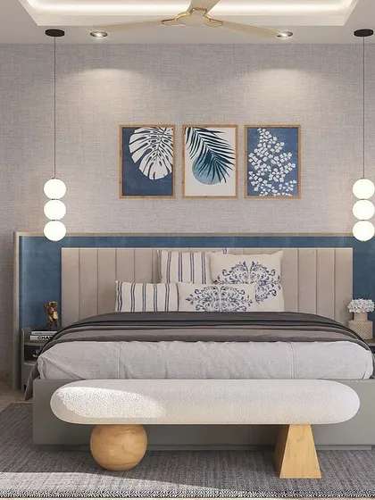 A centered view of the DLF bedroom, showing the symmetry of the design. The trio of botanical prints above the bed adds a touch of nature, enhancing the room's serene and relaxing feel.