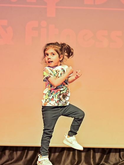 Meet Dea, one of our toddler stars, captured mid-performance. Her energy and expression show what our dance program can nurture.
