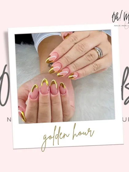 The golden hour trend, captured on your nails. This look combines a clean, transparent base with a striking gold chrome French tip, offering a chic and luxurious style that’s perfect for any occasion, day or night.