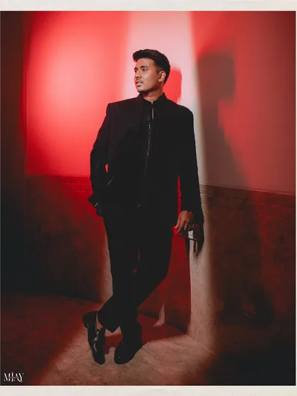 A moody and dramatic portrait of the groom, with a red light adding a bold, cinematic feel.