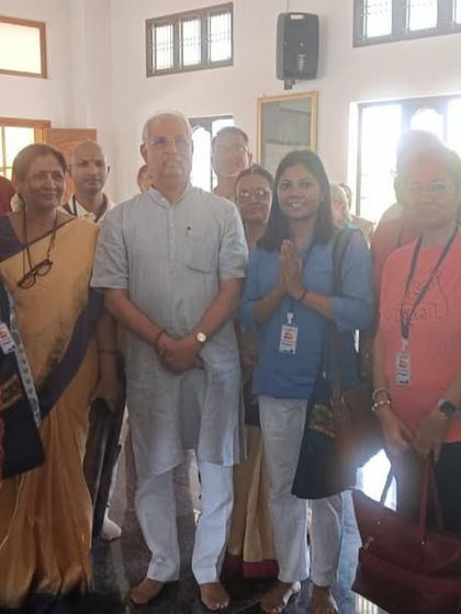 Dr. Sushama Maurya with a group of attendees and dignitaries at the conference, fostering connections within the global yoga community.