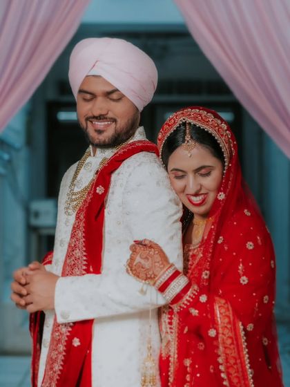 A candid photo capturing the couple's happiness and relief after completing their wedding rituals.