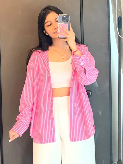 A simple yet chic office fit. I paired a pink striped shirt with a white tank top and trousers for a fresh and modern corporate look.