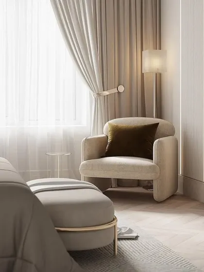 A cozy corner of the bedroom, featuring a comfortable armchair by the window. We always aim to create functional and relaxing zones within a room.