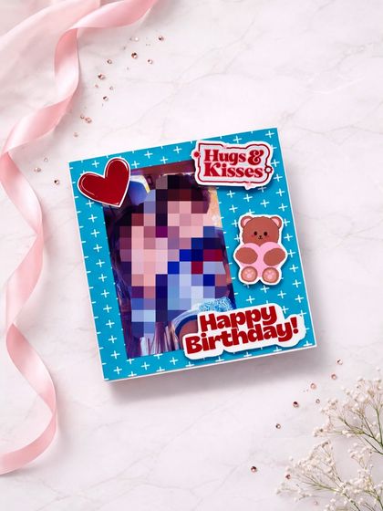 The cover of a cute and compact flipbook album, perfect for a birthday, with fun stickers like "Hugs & Kisses."