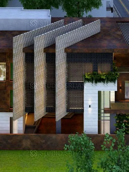 An aerial view of the Varanasi villa, showing the unique, blade-like roof elements. This architectural feature adds a dramatic and sculptural quality to the building's silhouette.