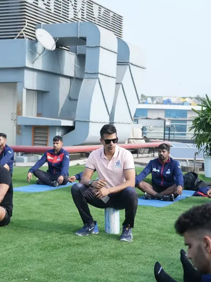 Leading a breathwork and mobility session before a match. Calming the mind and preparing the body are equally important.