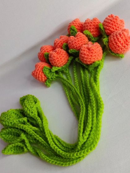 A bundle of neon orange tulip bookmarks.