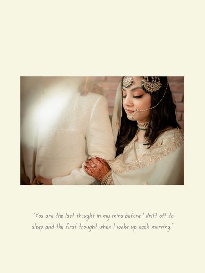 A soft and romantic close-up, with the bride's hand on the groom's chest, her gaze full of love and admiration.