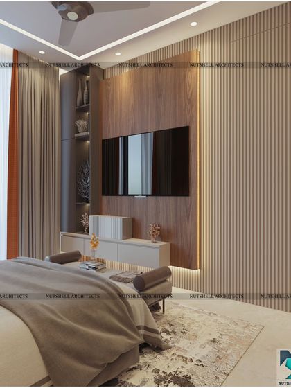 This bedroom design features a striking TV unit with integrated shelving against a backdrop of fluted panels. The warm wood tones and soft backlighting create a cozy and inviting atmosphere.
