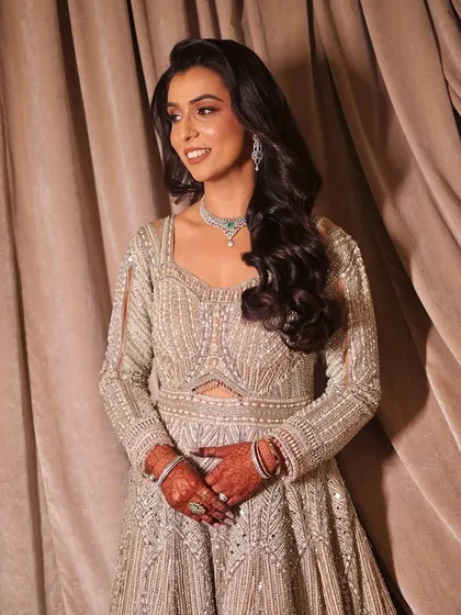 A three-quarter view of the bride, looking elegant and poised.