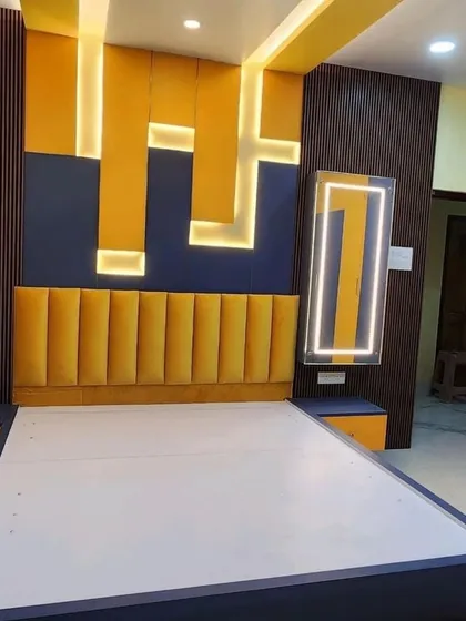 For a client who loves bold colors, I designed this bedroom with a vibrant yellow and deep blue color scheme. The geometric, backlit wall feature adds a playful and energetic feel.