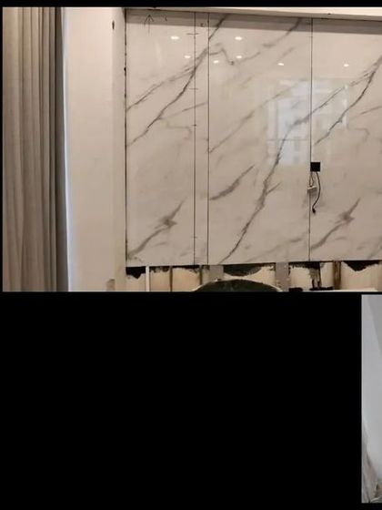 The process of creating the hidden door panels. We used large-format tiles with a marble finish to ensure a flawless, continuous look across the wall.
