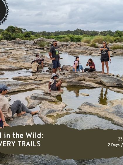 'Pedal in the Wild' along the Cauvery Trails offers more than just cycling. Here, a group takes a break to relax by the river, a perfect activity for non-riding family and friends.